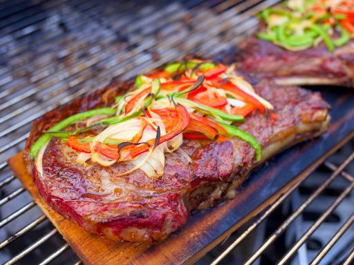 Steak on wood grilling board