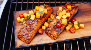 cooking fish on grilling boards